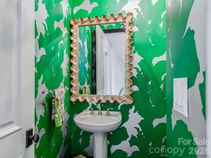 a bathroom with a sink and mirror