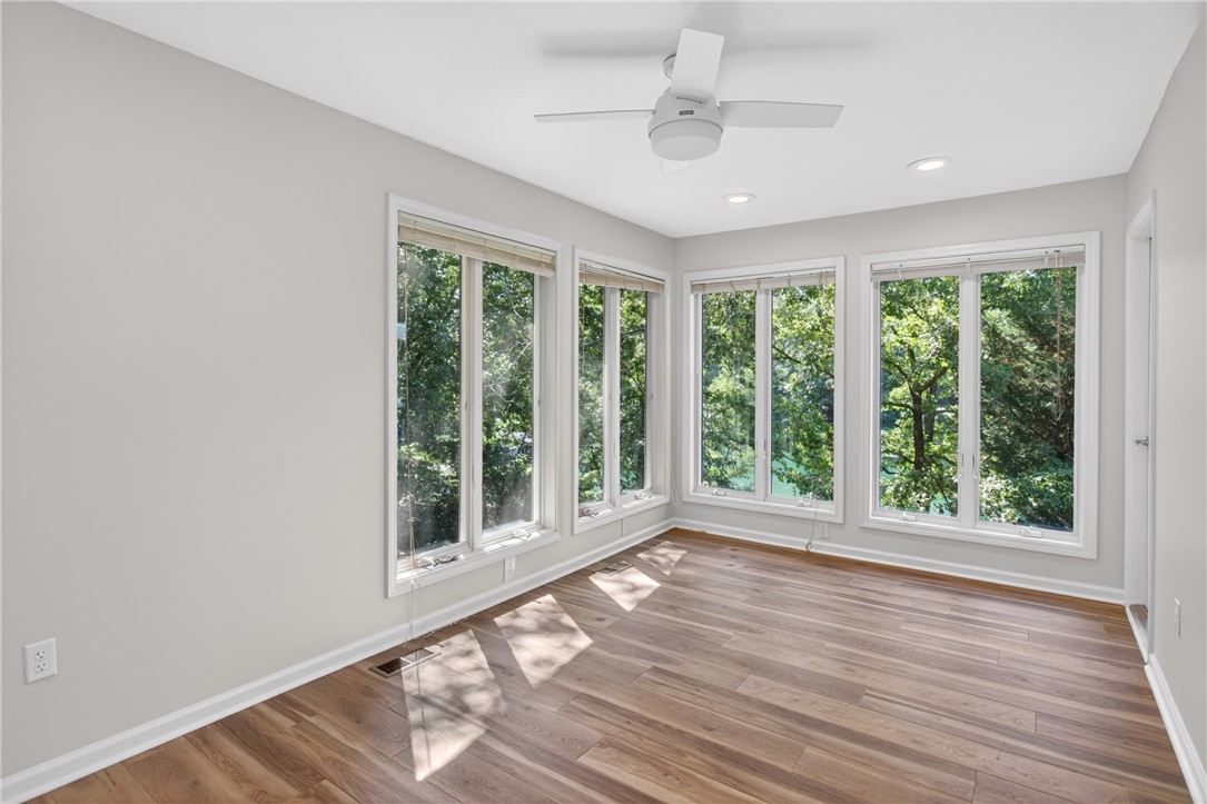 9 Lookout Lane Salem, SC 29676 - Photo 14 of 46 The serene arboreal views from the expansive windows define this well-lit room.