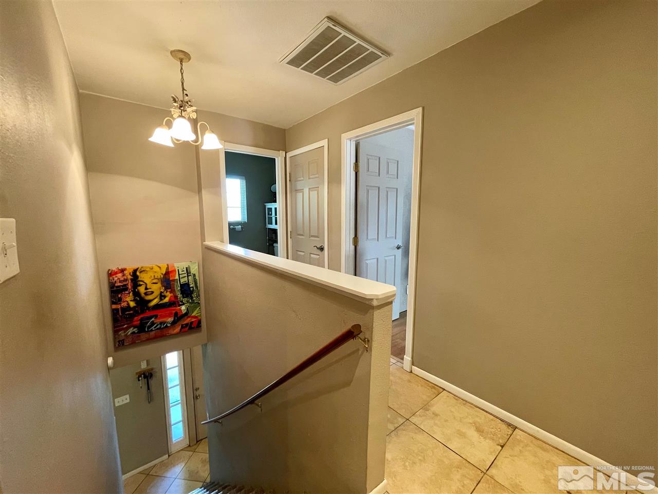 814 McLean Road Fallon, NV 89406 - Photo 16 of 40 a very nice looking room with a chandelier