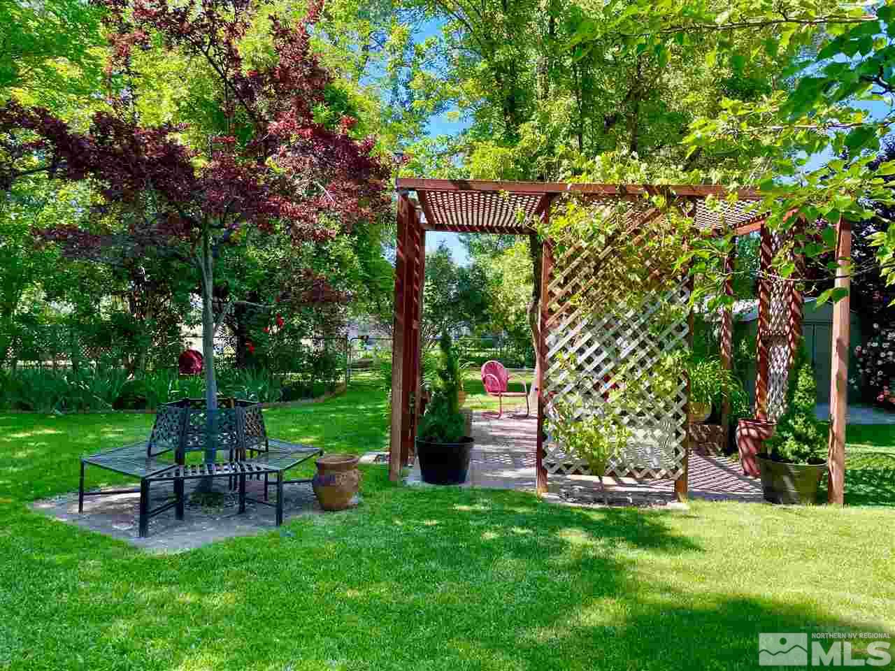 814 McLean Road Fallon, NV 89406 - Photo 36 of 40 a view of a chair and table in the garden and trees