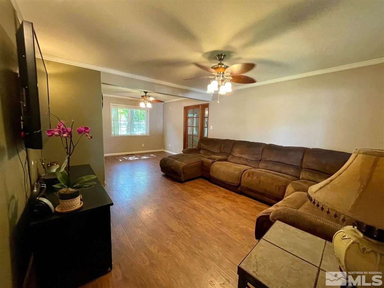 814 McLean Road Fallon, NV 89406 - Photo 4 of 40 a living room with furniture and a chandelier