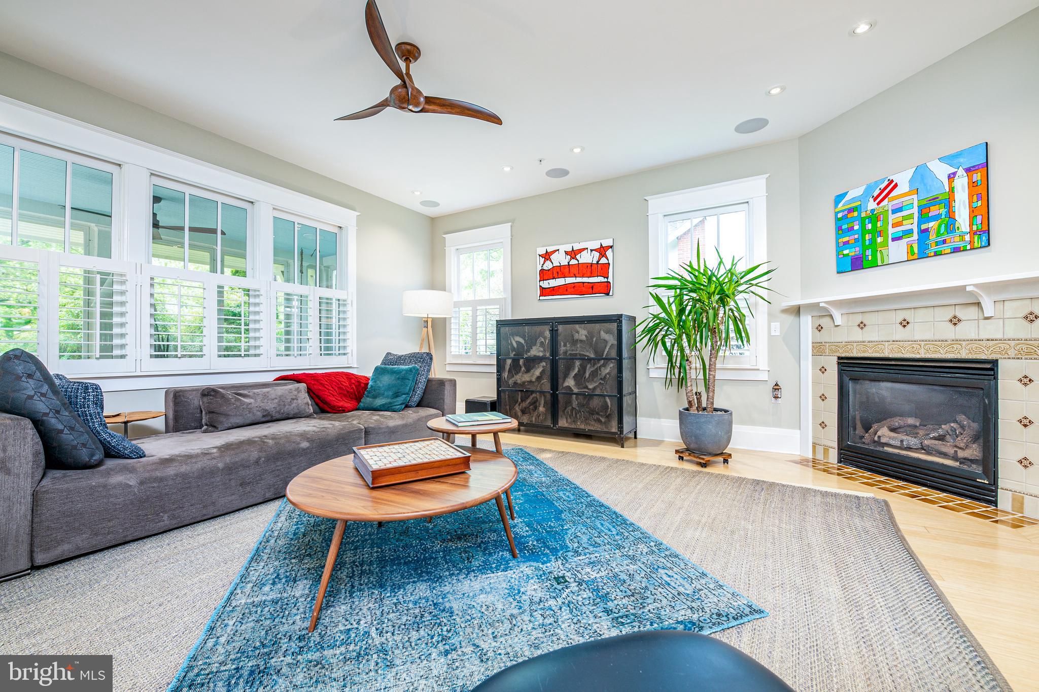 5809 Sherier Place Northwest Washington, DC 20016 - Photo 4 of 48 Light-filled living room with gas fireplace