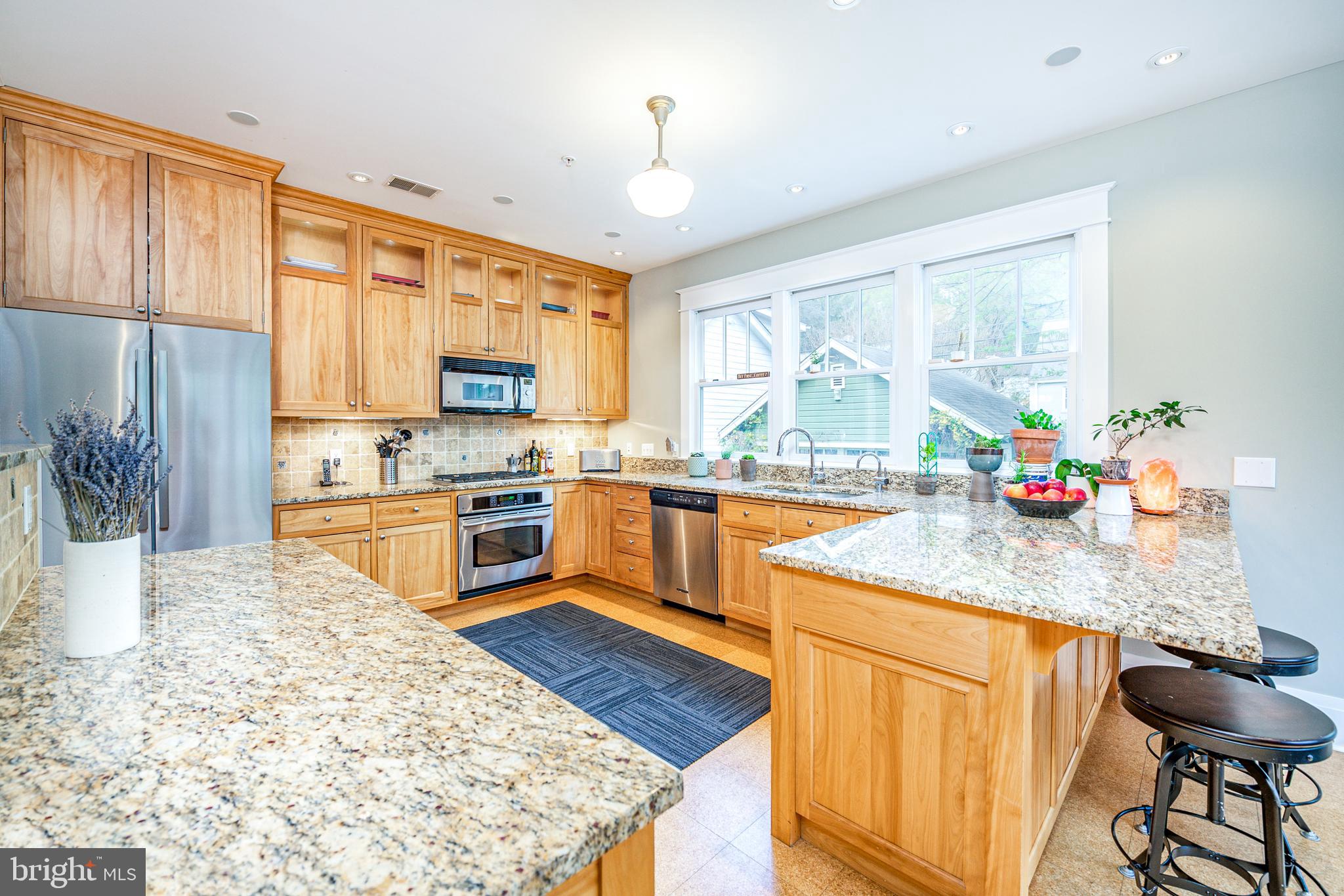 5809 Sherier Place Northwest Washington, DC 20016 - Photo 9 of 48 kitchen has granite counters, ss appliances