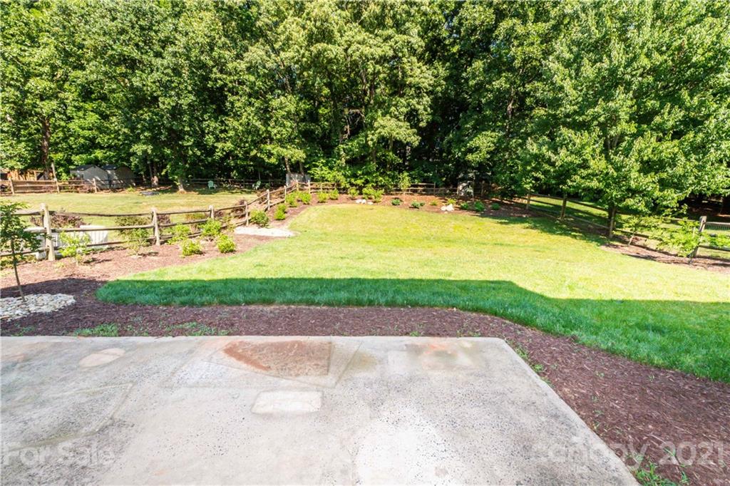 831 Knightsbridge Road, Unit 5 Fort Mill, SC 29708 - Photo 5 of 32 a view of yard with swimming pool and green space