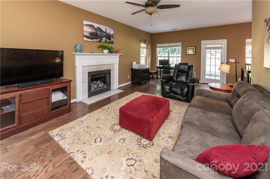 831 Knightsbridge Road, Unit 5 Fort Mill, SC 29708 - Photo 8 of 32 a living room with furniture and a flat screen tv