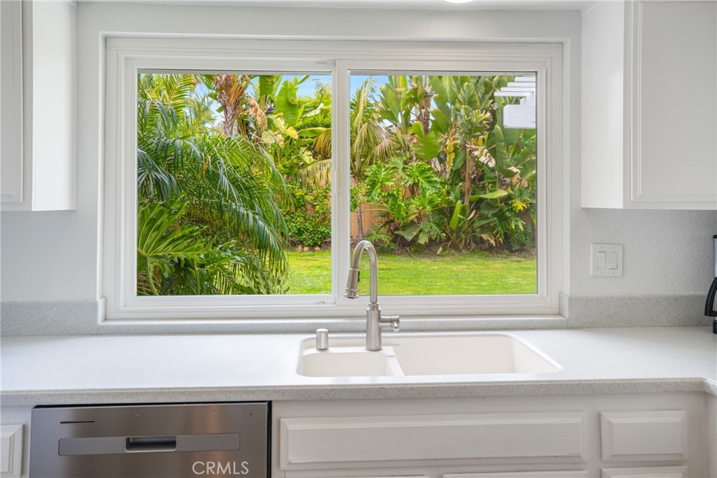 2204 Recodo Court Carlsbad, CA 92009 - Photo 14 of 44 a sink with a window and a yard