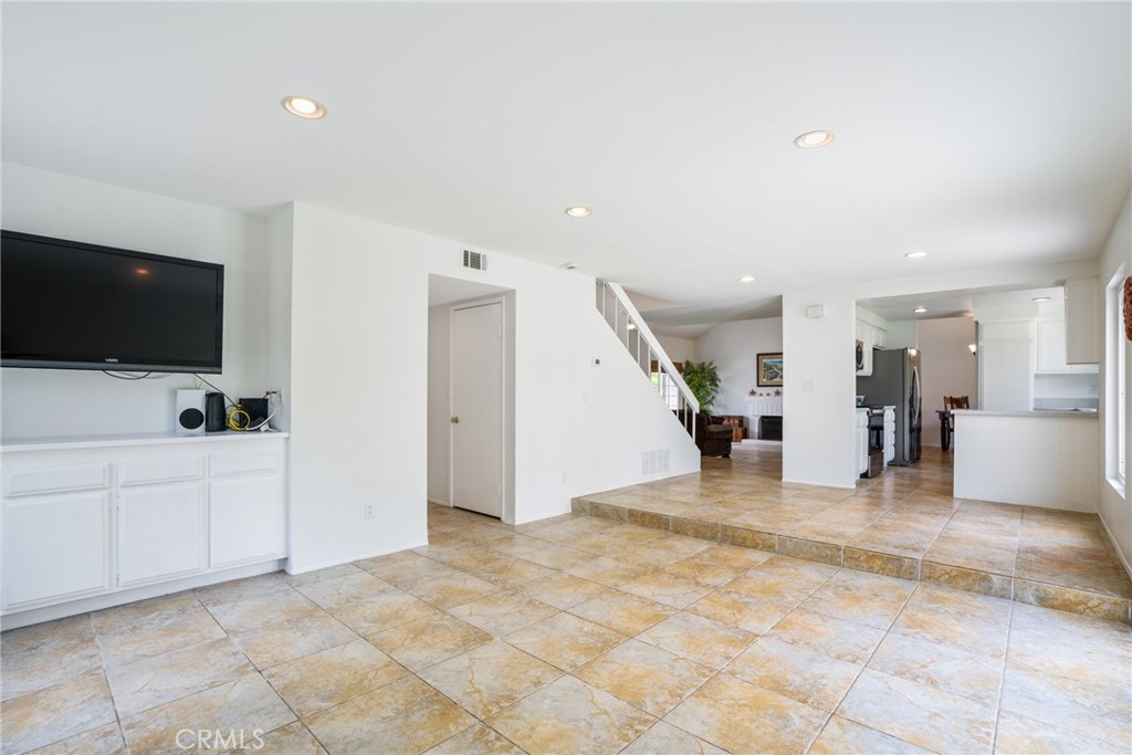 2204 Recodo Court Carlsbad, CA 92009 - Photo 18 of 44 a view of a livingroom with furniture and a flat screen tv