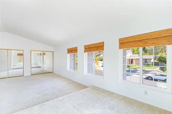 a view of empty room with floor to ceiling window