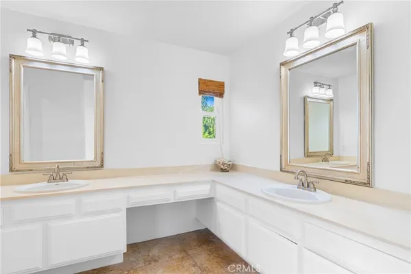 a bathroom with a sink toilet and a mirror