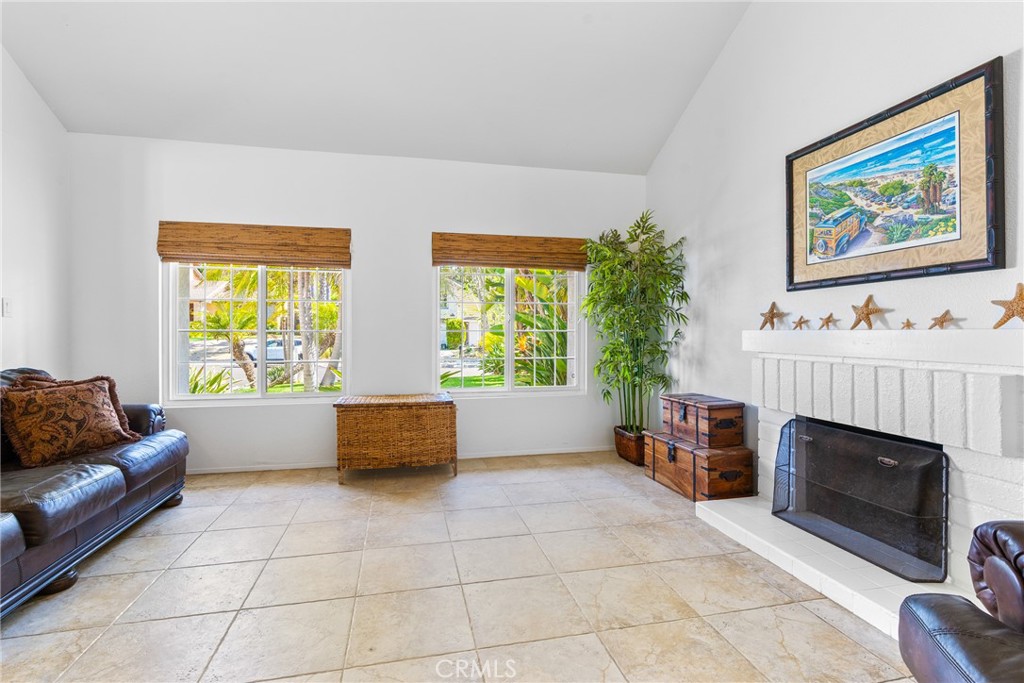 2204 Recodo Court Carlsbad, CA 92009 - Photo 7 of 44 a living room with furniture and a fireplace