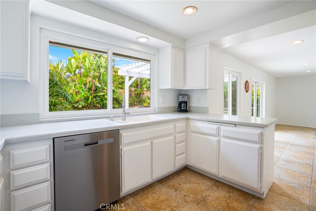 2204 Recodo Court Carlsbad, CA 92009 - Photo 10 of 44 a kitchen with a sink cabinets and window