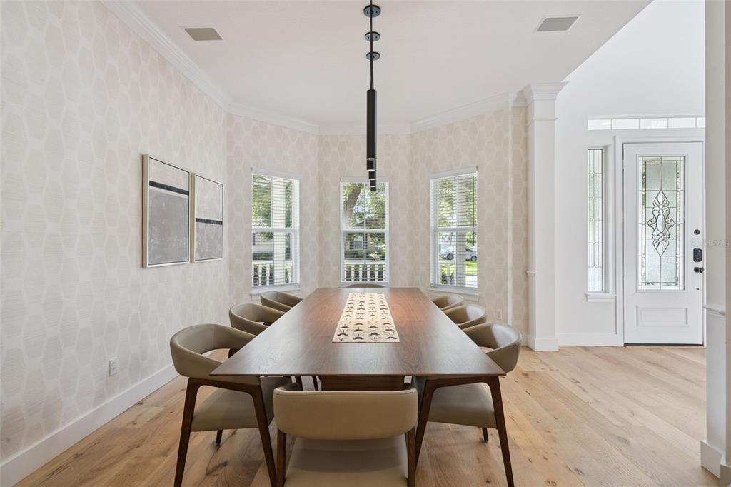 908 Croton Road Celebration, FL 34747 - Photo 15 of 86 a view of a dining room with furniture window and wooden floor
