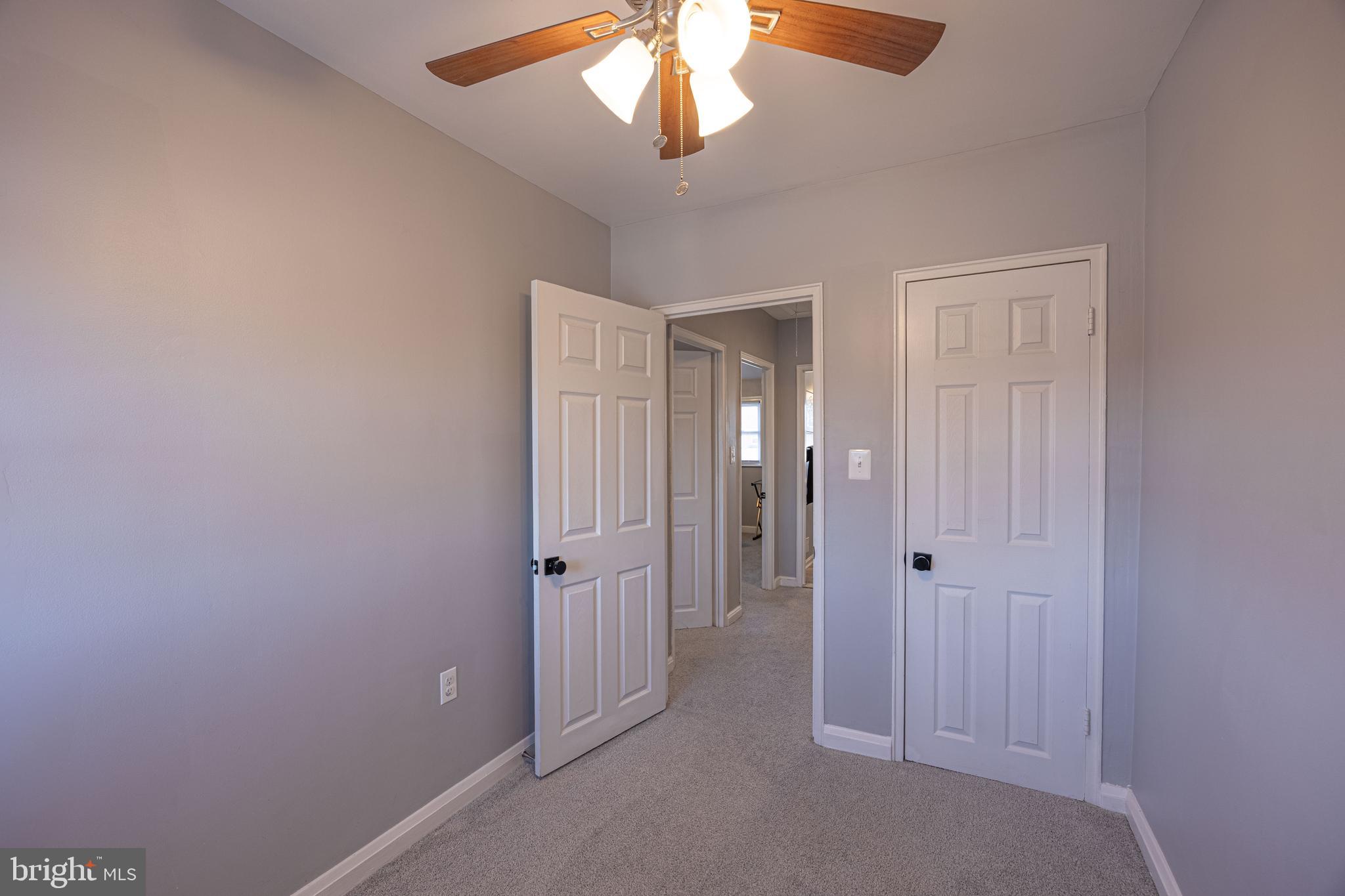 1953 Wareham Road Baltimore, MD 21222 - Photo 22 of 40 a view of a hallway with chandelier fan