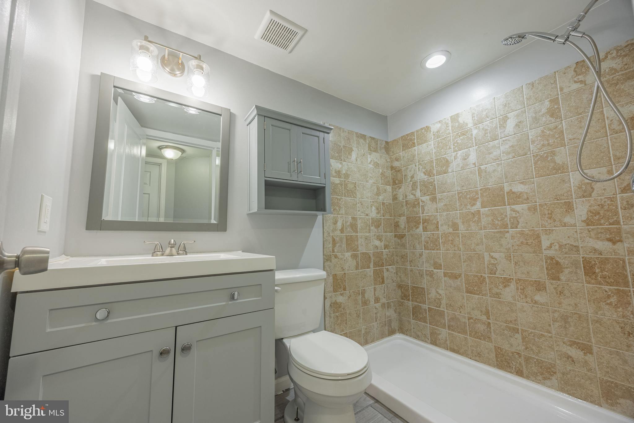 1953 Wareham Road Baltimore, MD 21222 - Photo 31 of 40 a bathroom with a sink a toilet and shower