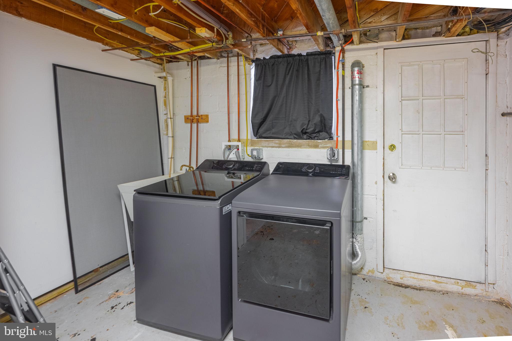 1953 Wareham Road Baltimore, MD 21222 - Photo 32 of 40 a utility room with a sink a vanity and a mirror