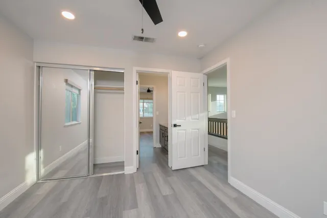 a bathroom with a double vanity sink mirror and a toilet