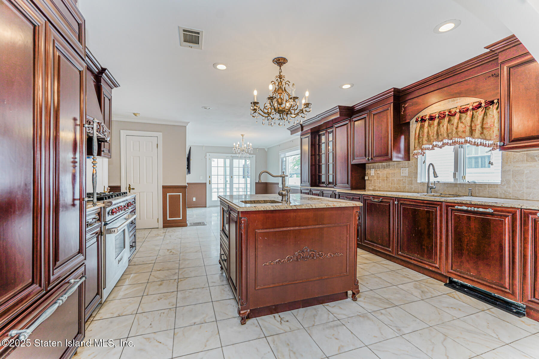 284 Todt Hill Road Staten Island, NY 10314 - Photo 11 of 29 a large kitchen with stainless steel appliances granite countertop a stove and a sink