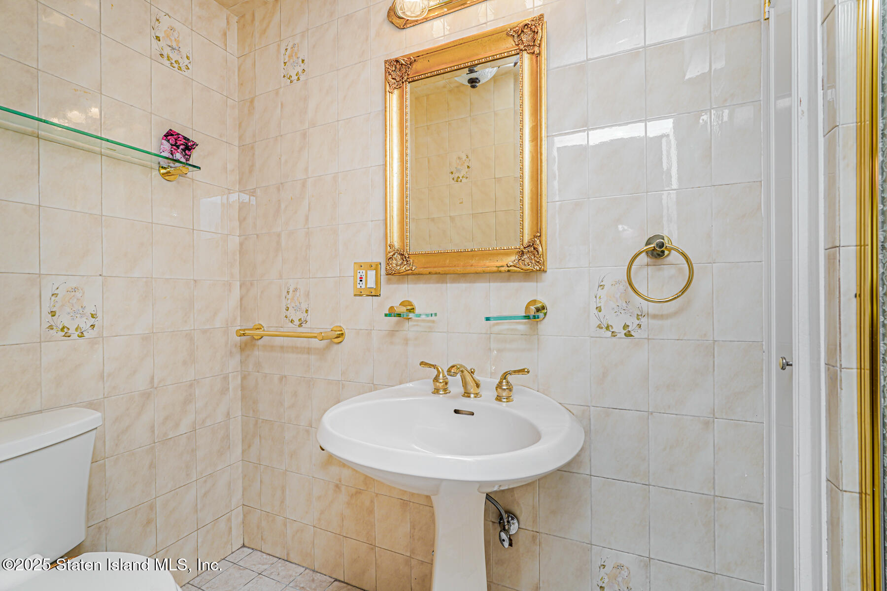 284 Todt Hill Road Staten Island, NY 10314 - Photo 13 of 29 a bathroom with a sink a toilet and shower