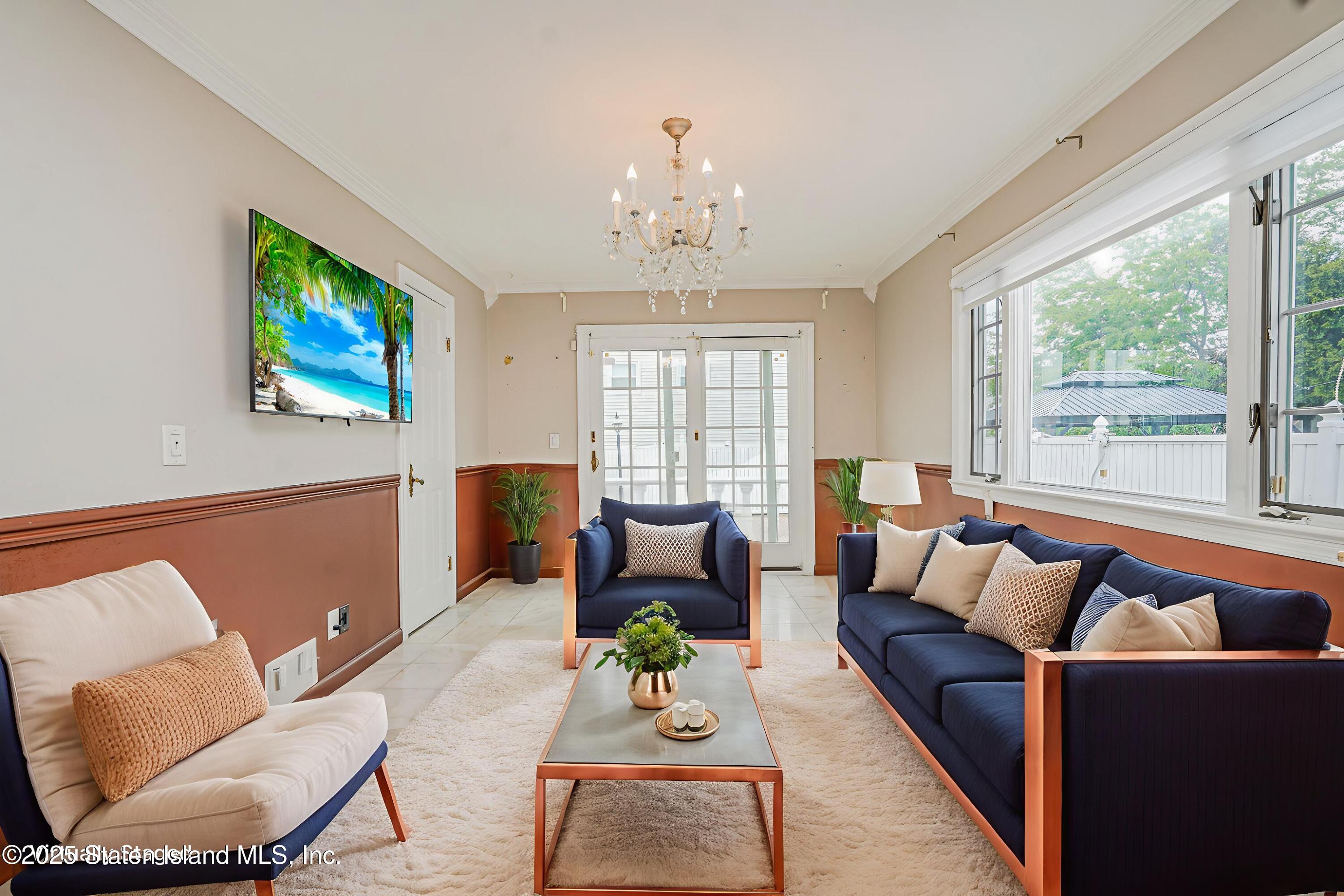 284 Todt Hill Road Staten Island, NY 10314 - Photo 15 of 29 a living room with furniture and a flat screen tv
