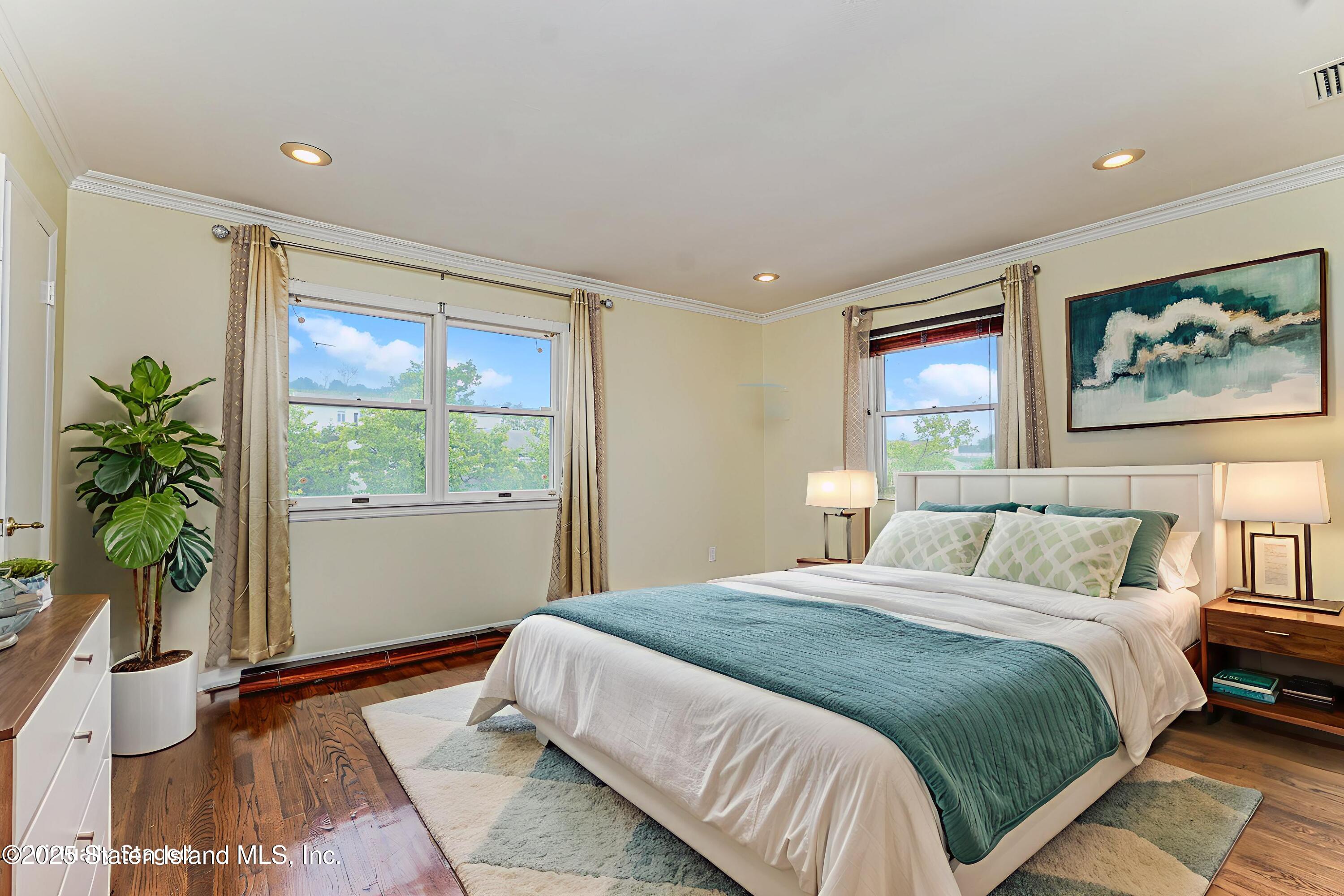 284 Todt Hill Road Staten Island, NY 10314 - Photo 22 of 29 a bedroom with bed and a large window