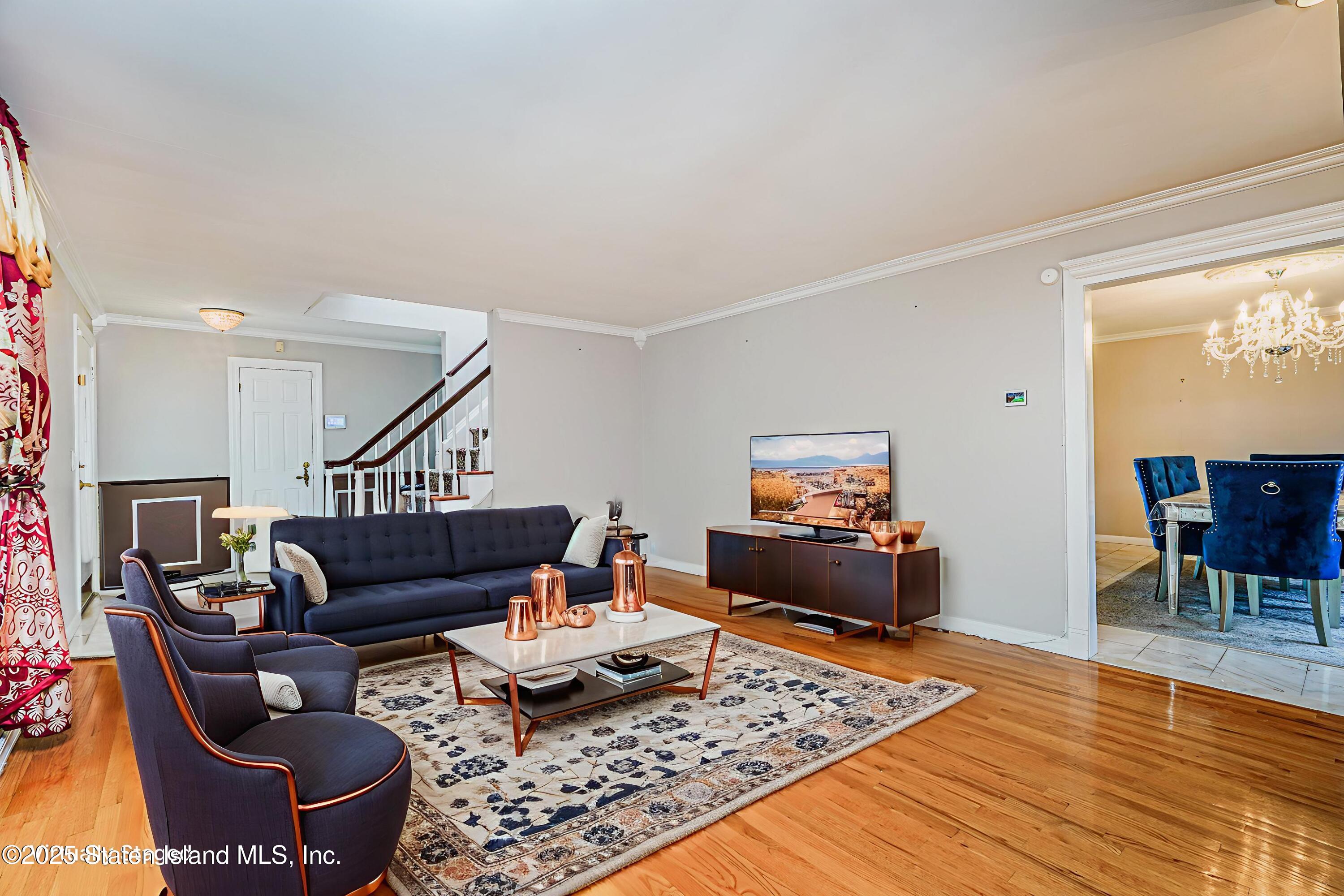 284 Todt Hill Road Staten Island, NY 10314 - Photo 8 of 29 a living room with furniture and wooden floor