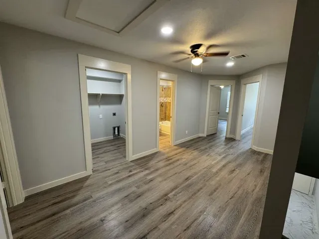 a view of a livingroom with wooden floor