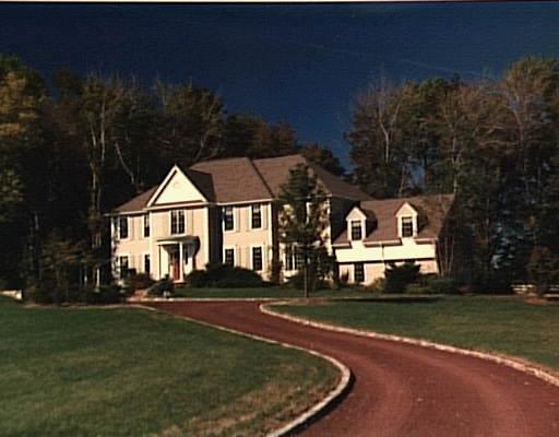 6 Hussars Camp Place Ridgefield, CT 06877 - Photo 1 of 1 a front view of a house with a yard