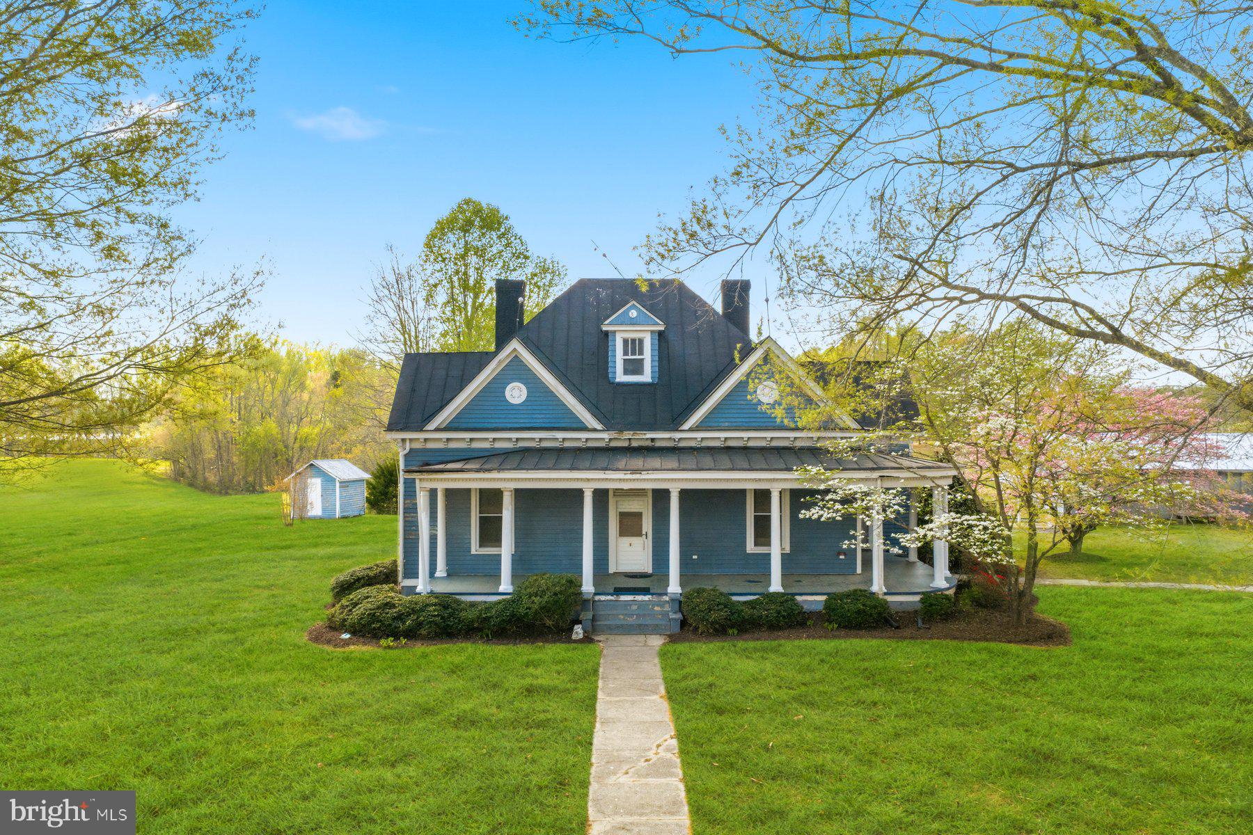 2136 Rocksprings Road Ringgold, VA 24586 - Photo 1 of 57 a front view of a house with garden