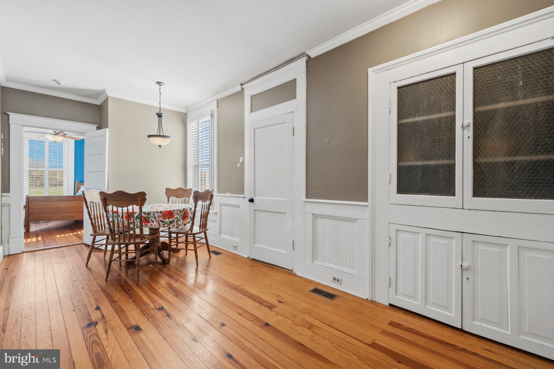 2136 Rocksprings Road Ringgold, VA 24586 - Photo 25 of 57 a view of a dining room with furniture and wooden floor