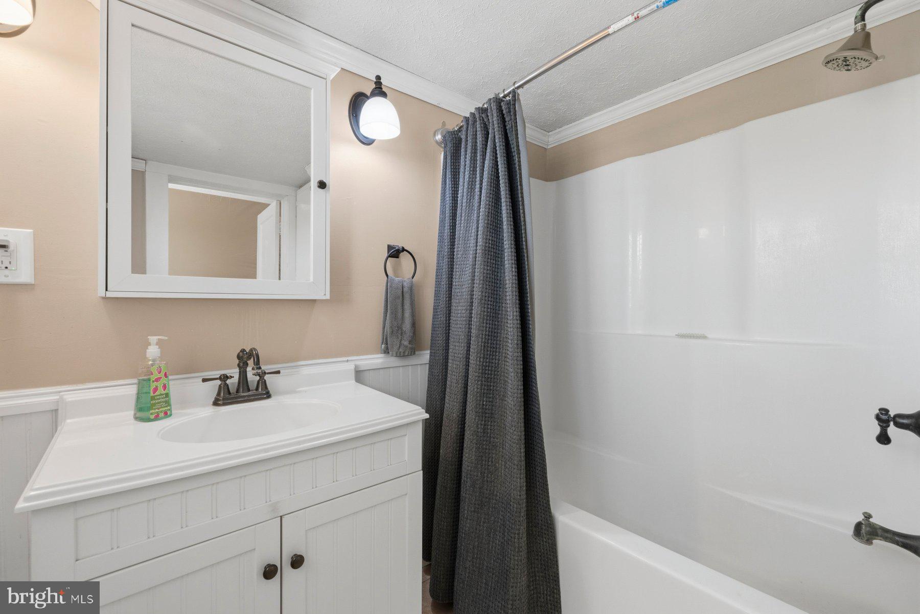 2136 Rocksprings Road Ringgold, VA 24586 - Photo 31 of 57 a bathroom with a sink and a mirror