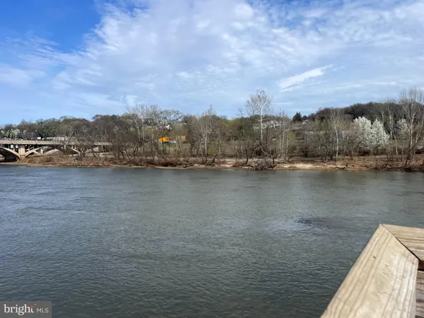 a bedroom with furniture and a fireplace