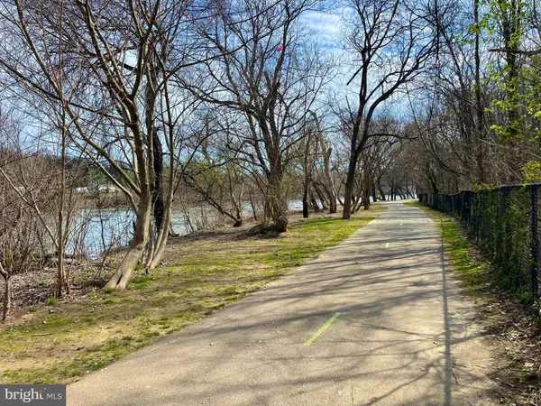 a bathroom with a glass door shower and a sink
