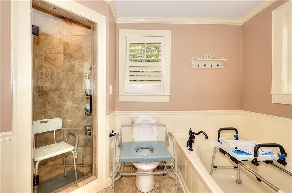 317 North Cherokee Road Social Circle, GA 30025 - Photo 19 of 32 a bathroom with a sink and a mirror