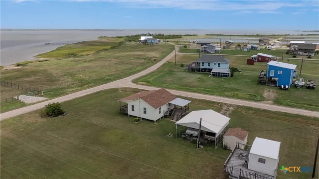 an aerial view of a house with a swimming pool