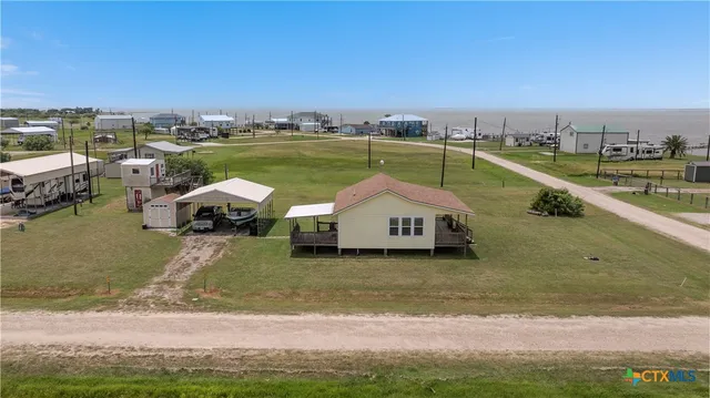 a view of a lake with a car parked
