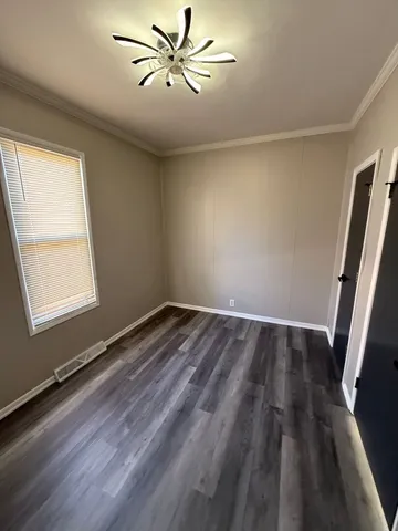 a bathroom with a tub a sink and a large mirror