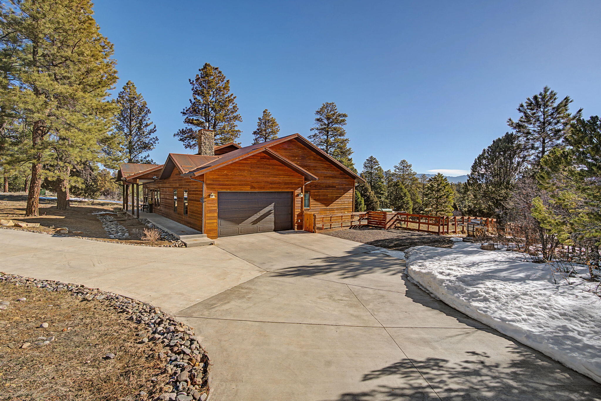 213 Big Canyon Point Ridgway, CO 81432 - Photo 37 of 41 a front view of a house with a yard and garage