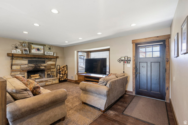 781 West 3000 South Heber City, UT 84032 - Photo 4 of 30 Living area with hardwood / wood-style flooring, recessed lighting, and a stone fireplace