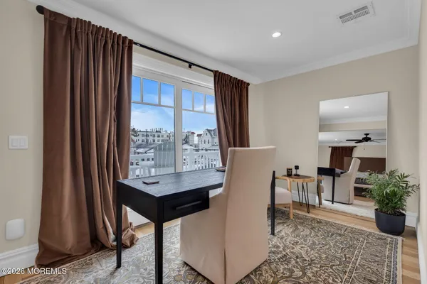 a view of a balcony with chairs