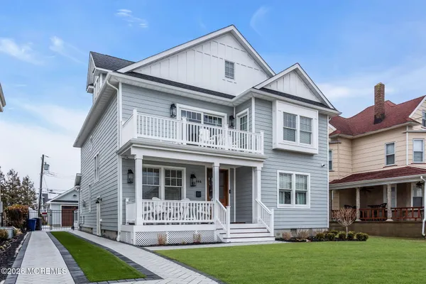 a view of a kitchen with a stove and a wooden floor