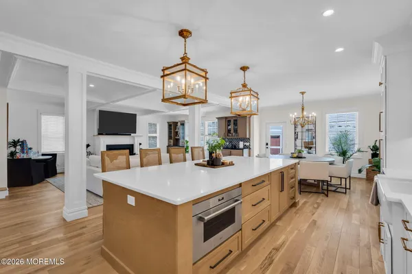 a city view with tall buildings and cars parked