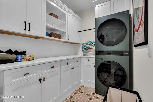 a close view of a utility room with washer and dryer