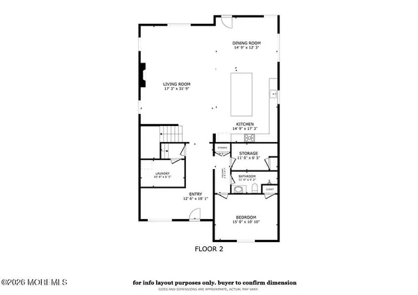a living room with furniture and a flat screen tv with kitchen view