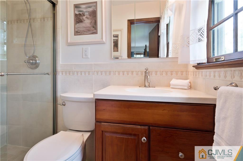 2 Doria Road Somerset, NJ 08873 - Photo 11 of 19 a bathroom with a sink a toilet and shower