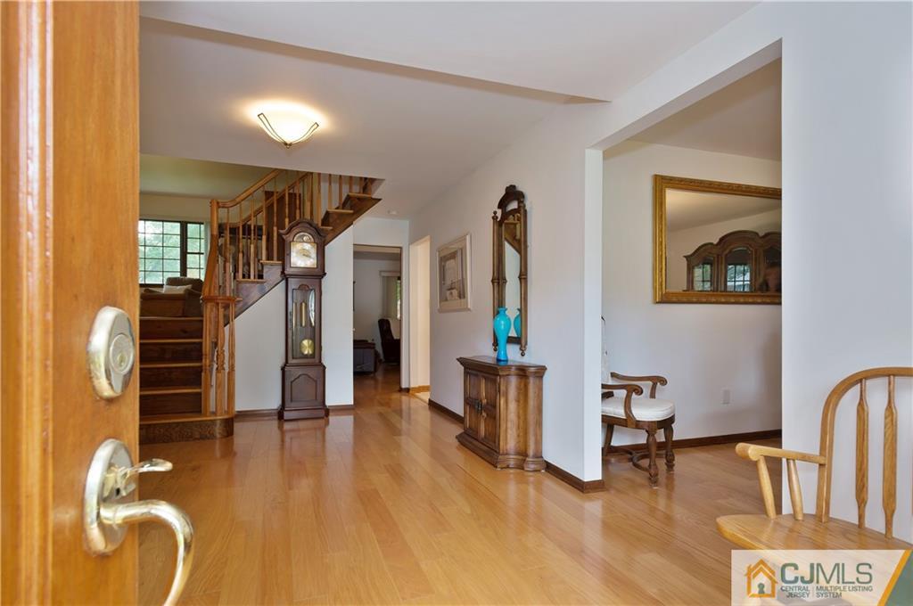 2 Doria Road Somerset, NJ 08873 - Photo 15 of 19 a view of a livingroom with furniture and staircase