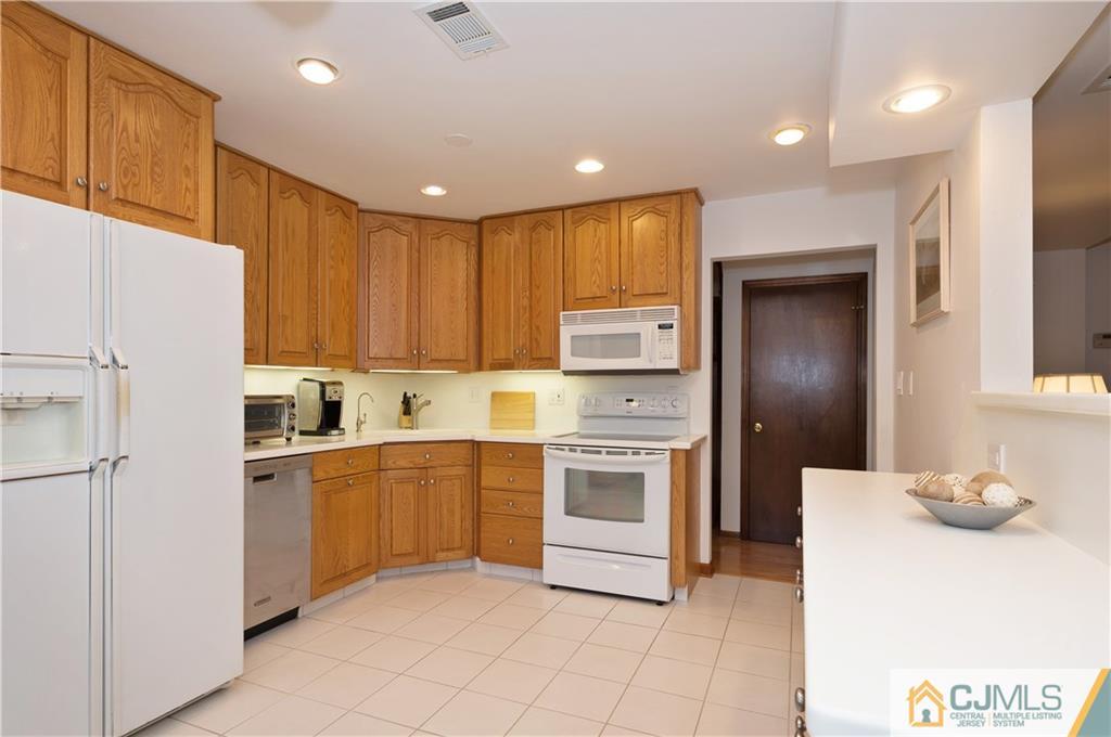 2 Doria Road Somerset, NJ 08873 - Photo 3 of 19 a kitchen with cabinets and stainless steel appliances