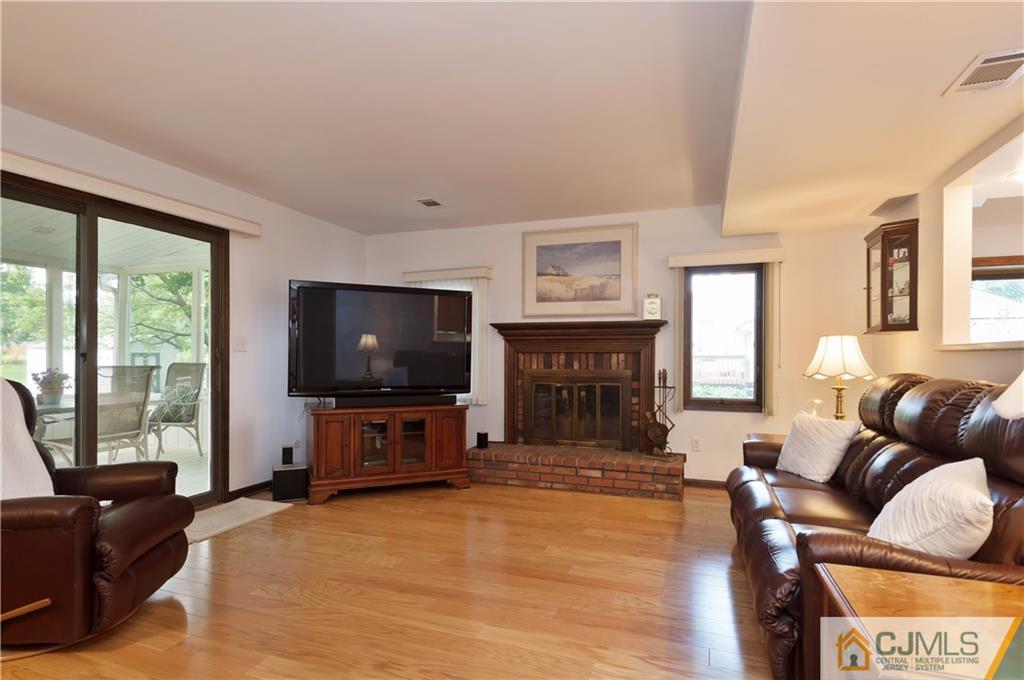 2 Doria Road Somerset, NJ 08873 - Photo 5 of 19 a living room with furniture and a flat screen tv