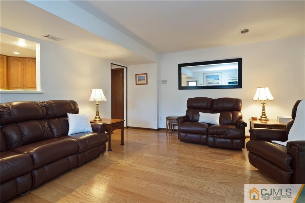 2 Doria Road Somerset, NJ 08873 - Photo 6 of 19 a living room with furniture and a wooden floor