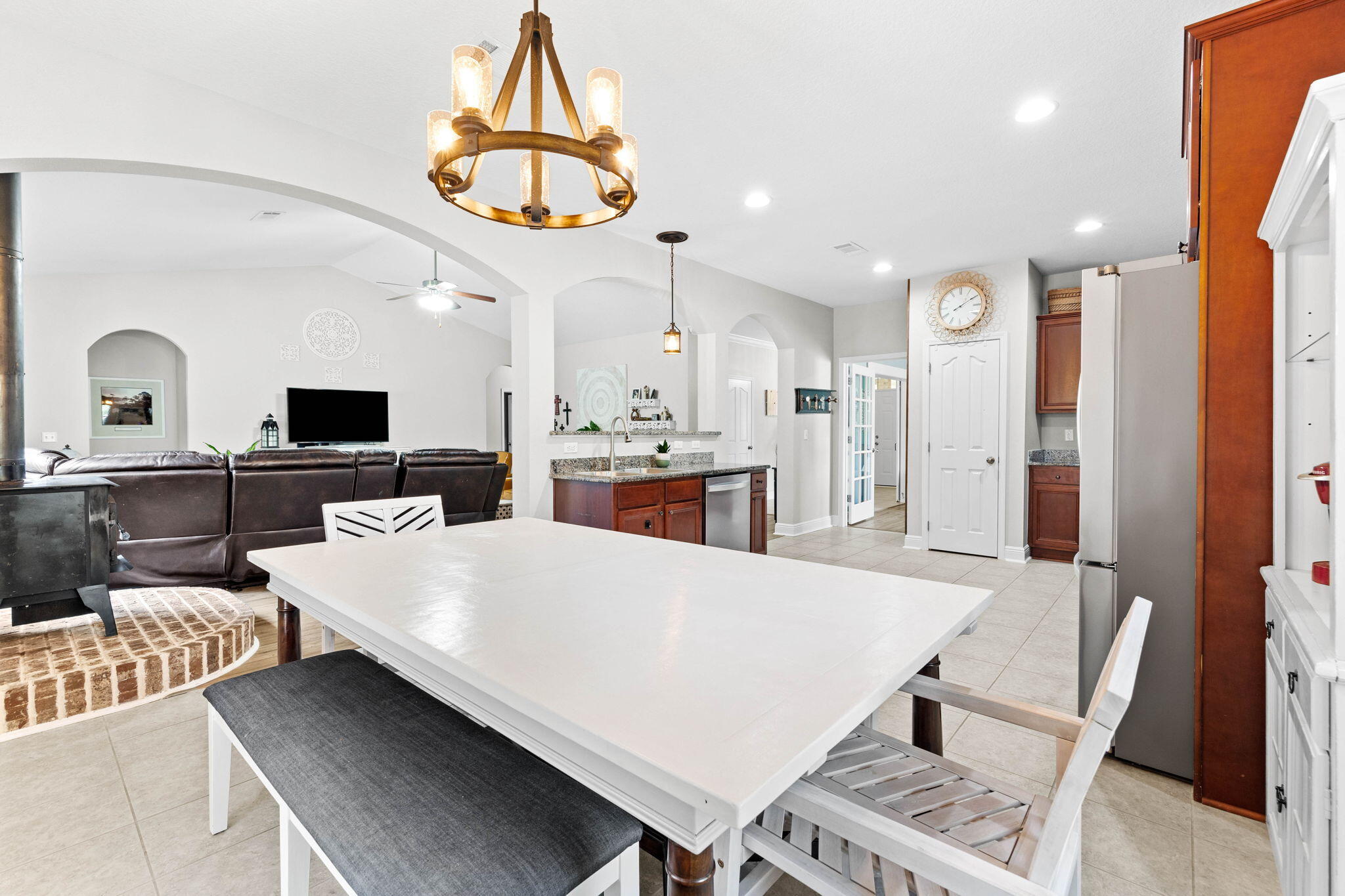 59 Echo Cove Freeport, FL 32439 - Photo 12 of 32 a living room with furniture a flat screen tv and a table