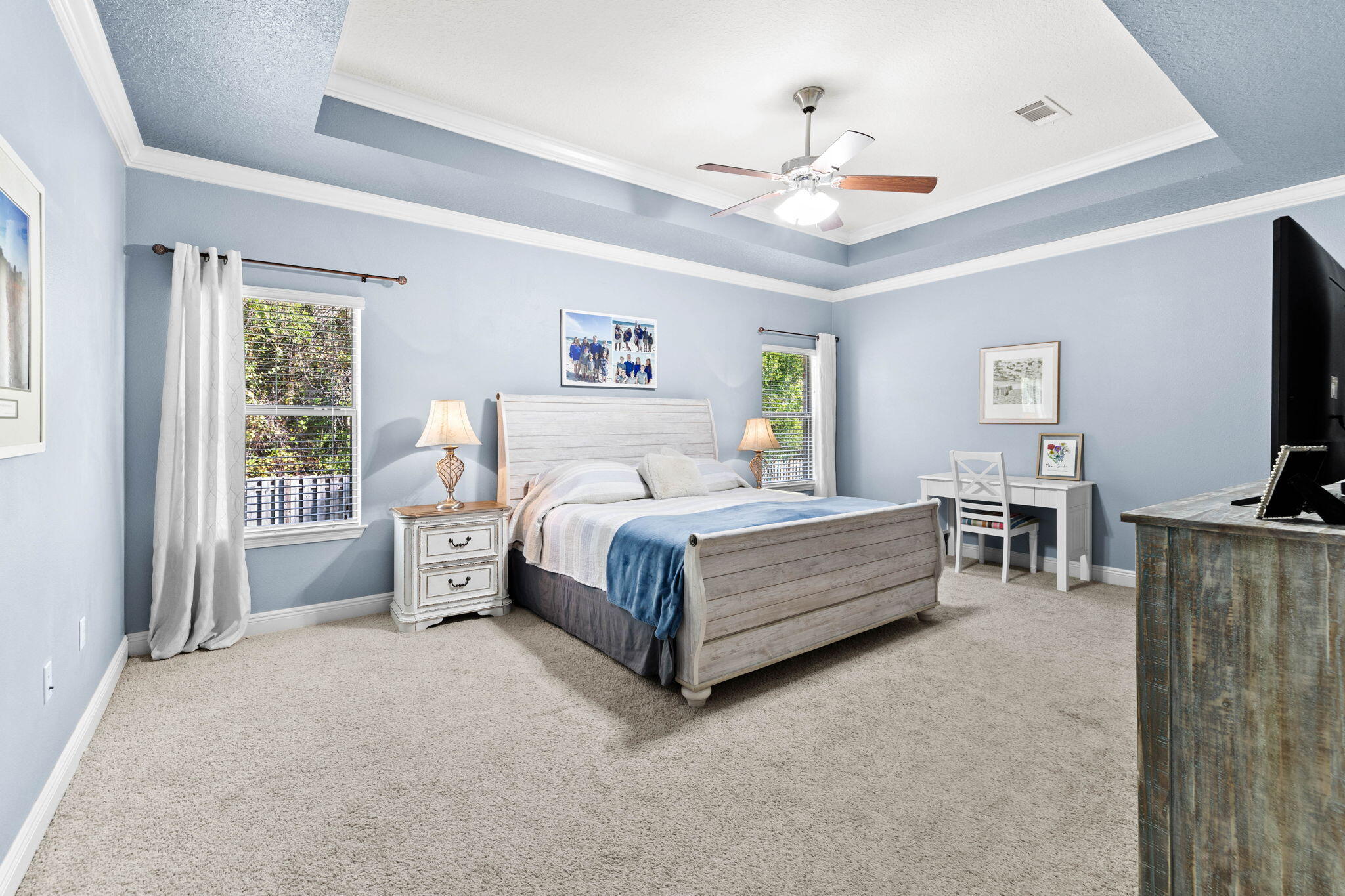 59 Echo Cove Freeport, FL 32439 - Photo 13 of 32 a spacious bedroom with a bed couch tv and a window